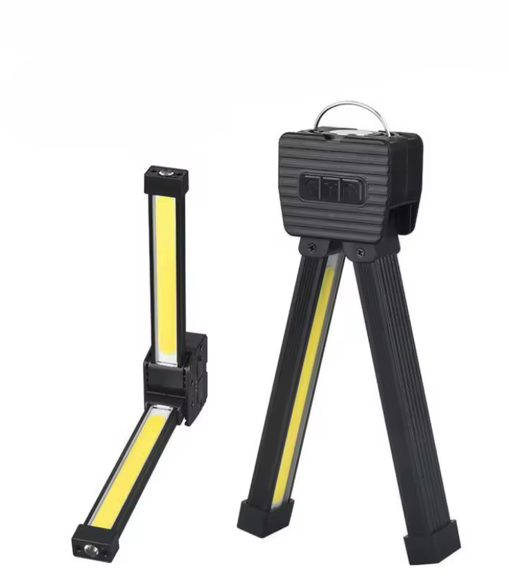 Multifunctional working light with tripod stand on a white background