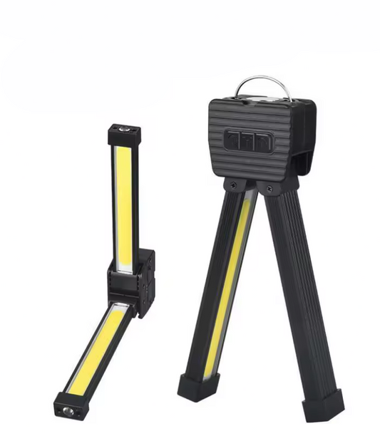Multifunctional working light with tripod stand on a white background